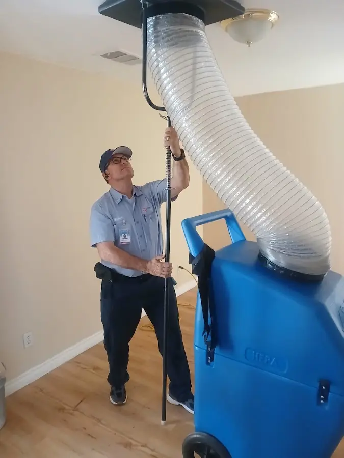 Furnace Tune-Up technician using HEPA equipment in Salida del Sol Estates